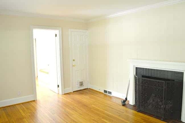 fireplace on yellow painted walls with hardwood floors