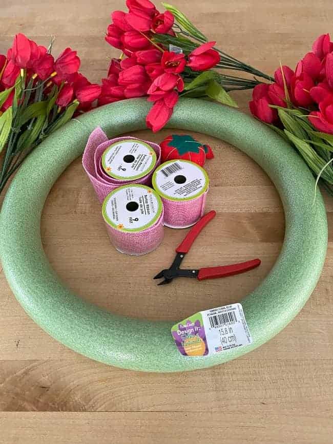 supplies to make tulip valentine wreath; wreath form, ribbon, wire cutters and red tulips 