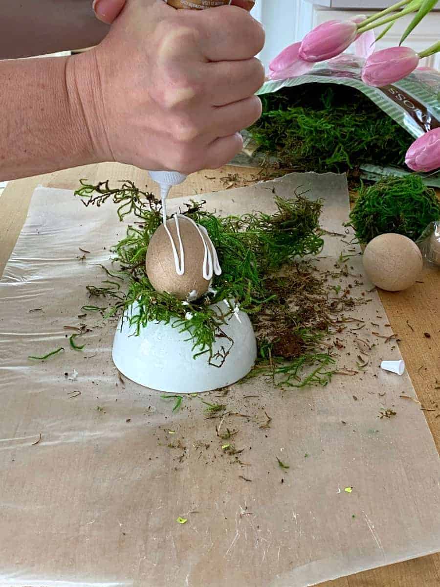 squirting tacky glue on paper mache Easter egg