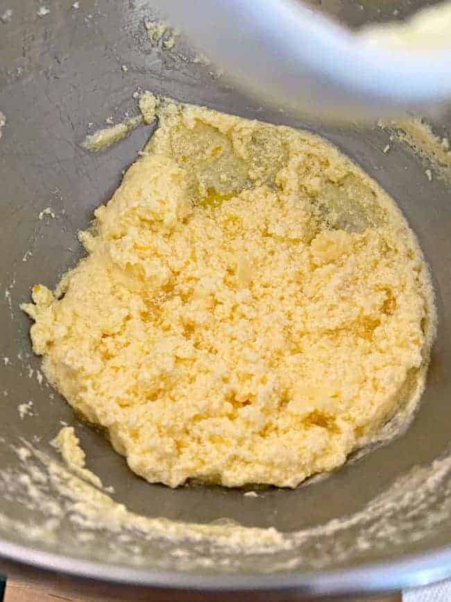 curdled lemon loaf batter in metal bowl