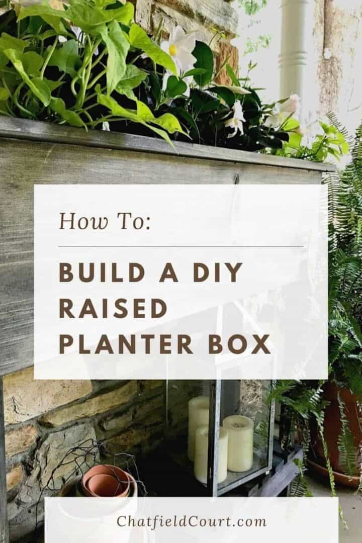 raised planter box with flowers in it and large graphic