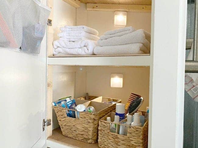 RV linen closet with battery operated motion lights