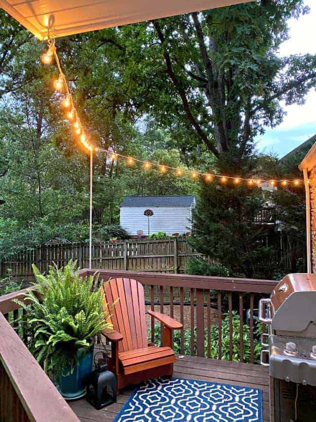 lit string lights hung around small deck