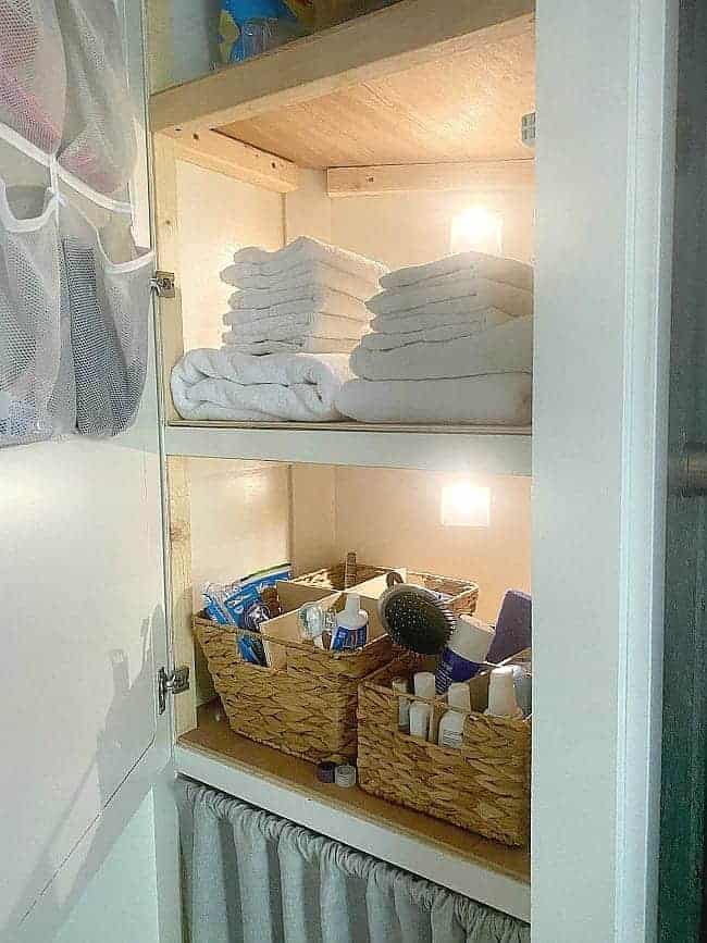 RV linen closet with battery operated motion lights