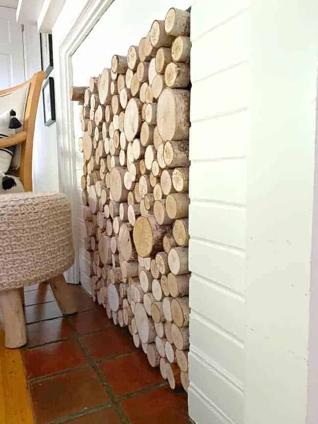 side view of logs sticking out of DIY fireplace screen