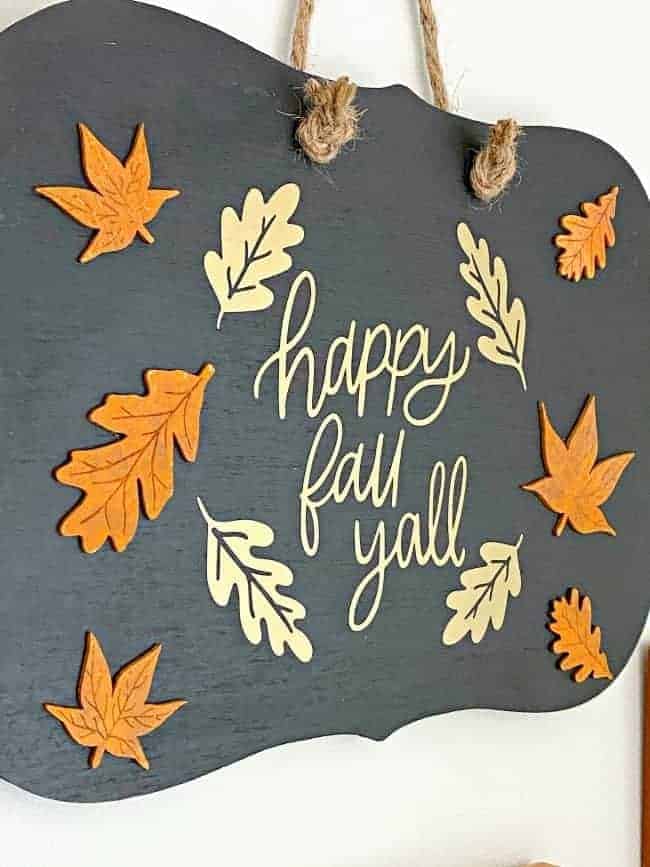 side view of happy fall yall sign on wood chalkboard