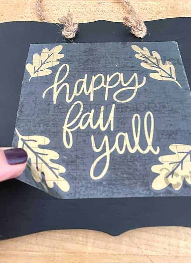 peeling off happy fall yall sticker off chalkboard sign