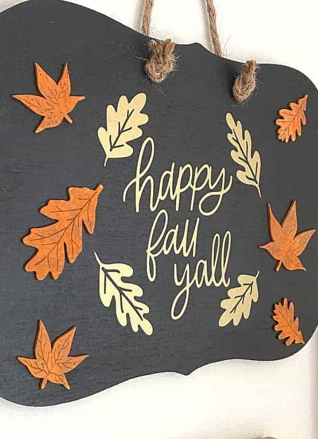 side view of happy fall yall sign on wood chalkboard