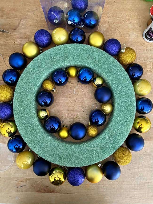 ornaments laid out around wreath form