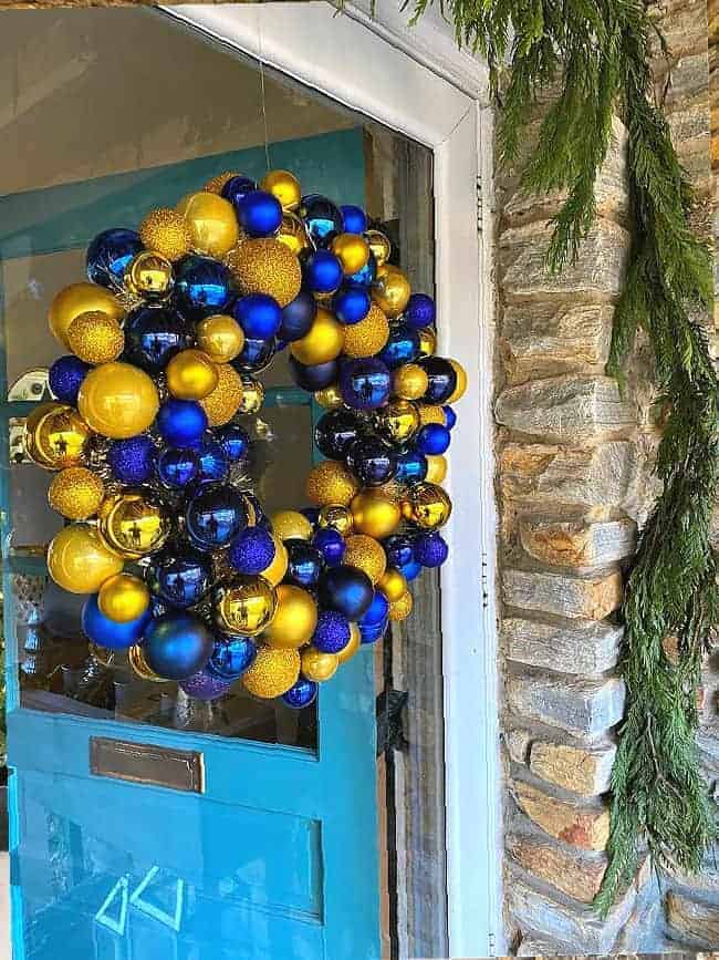 ornament wreath hanging on front door