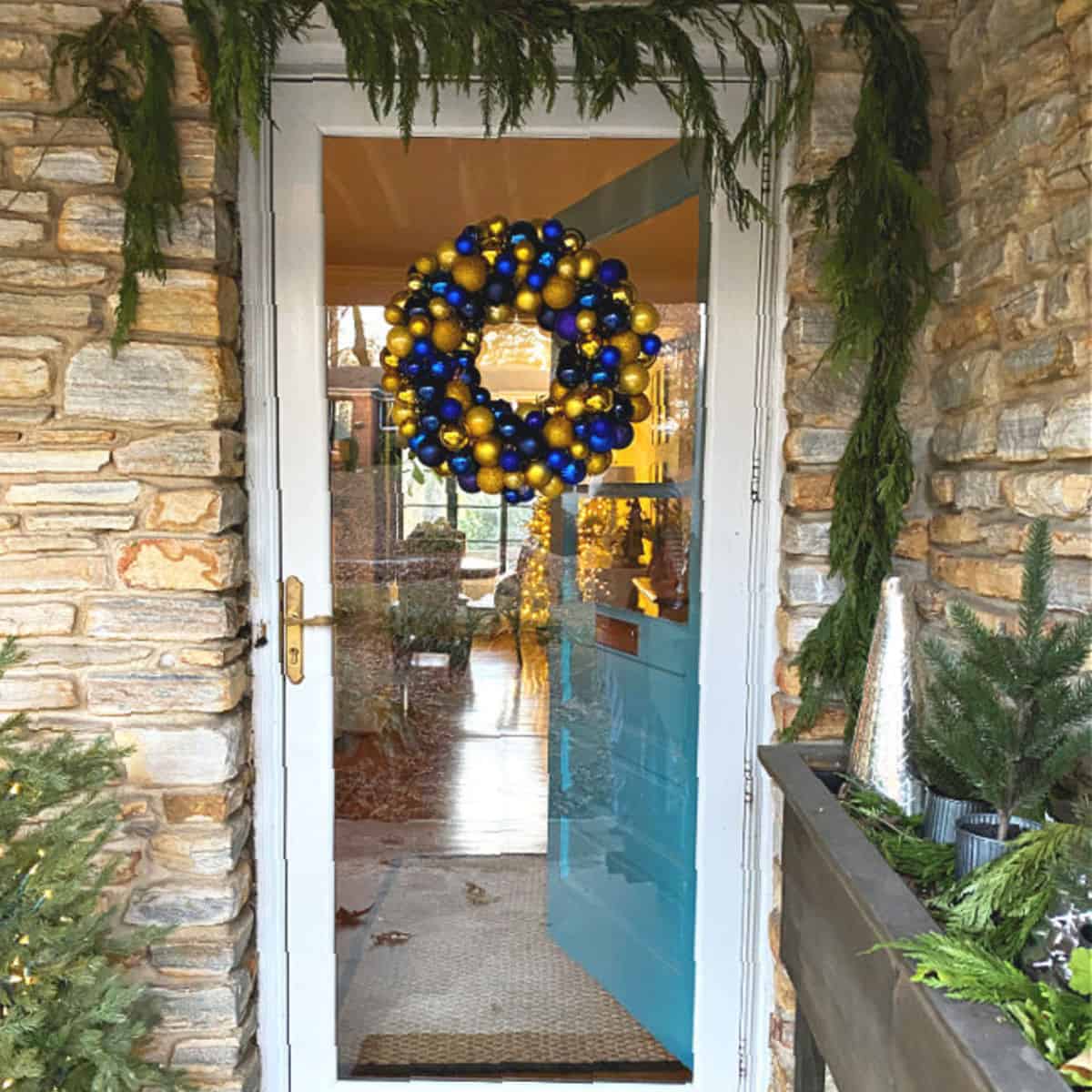 ornament wreath hanging on front door