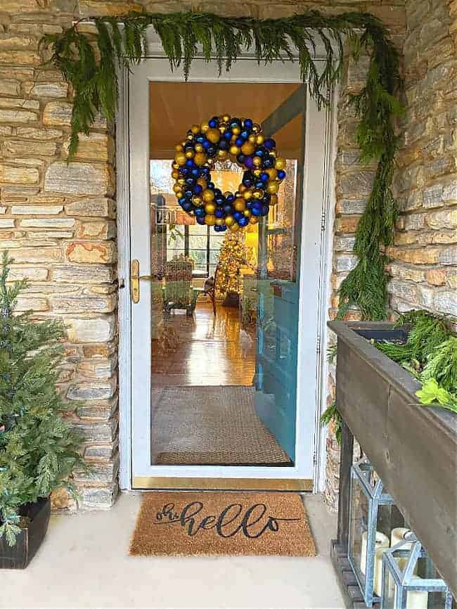 ornament wreath hanging on front door