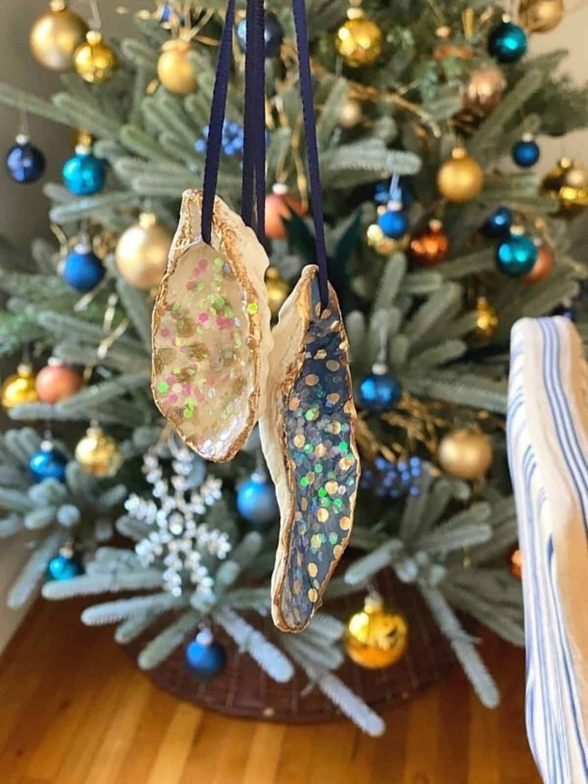 DIY seashell ornament hanging on a Christmas tree