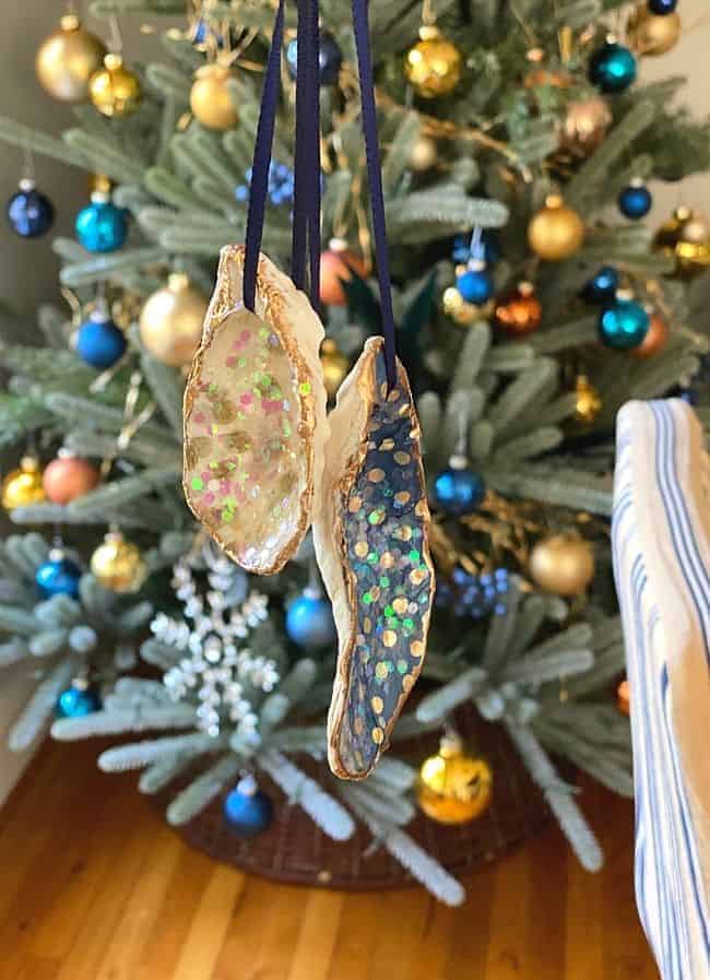 seashell ornaments in front of Christmas tree