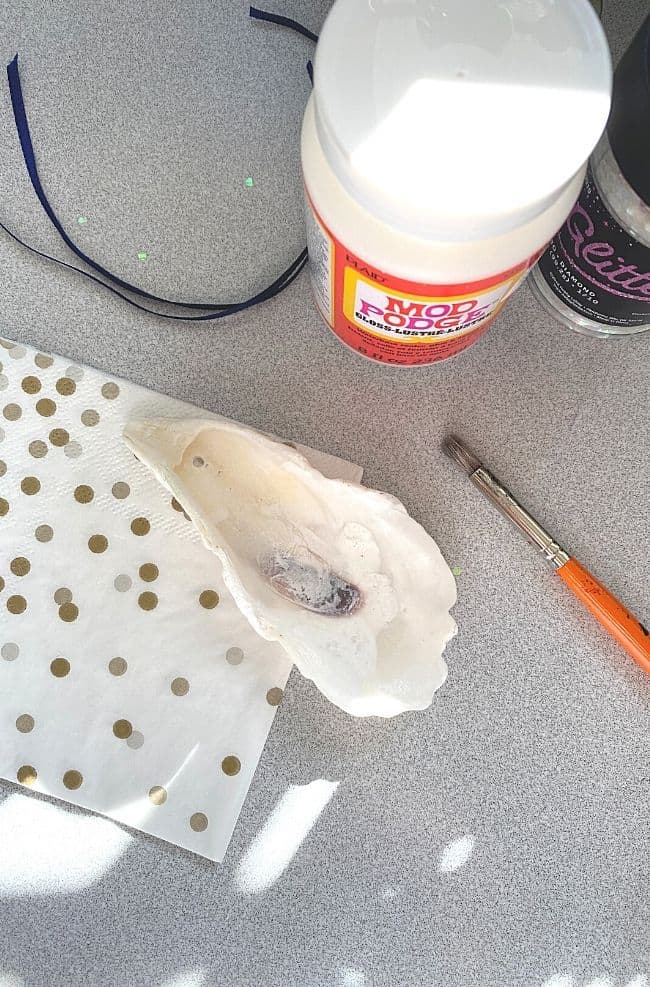 seashell, napkin, paintbrush and Mod Podge