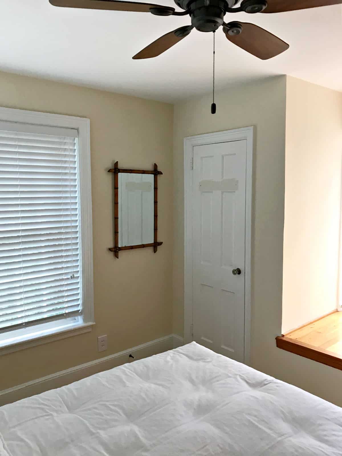 corner wall with mirror in bedroom 