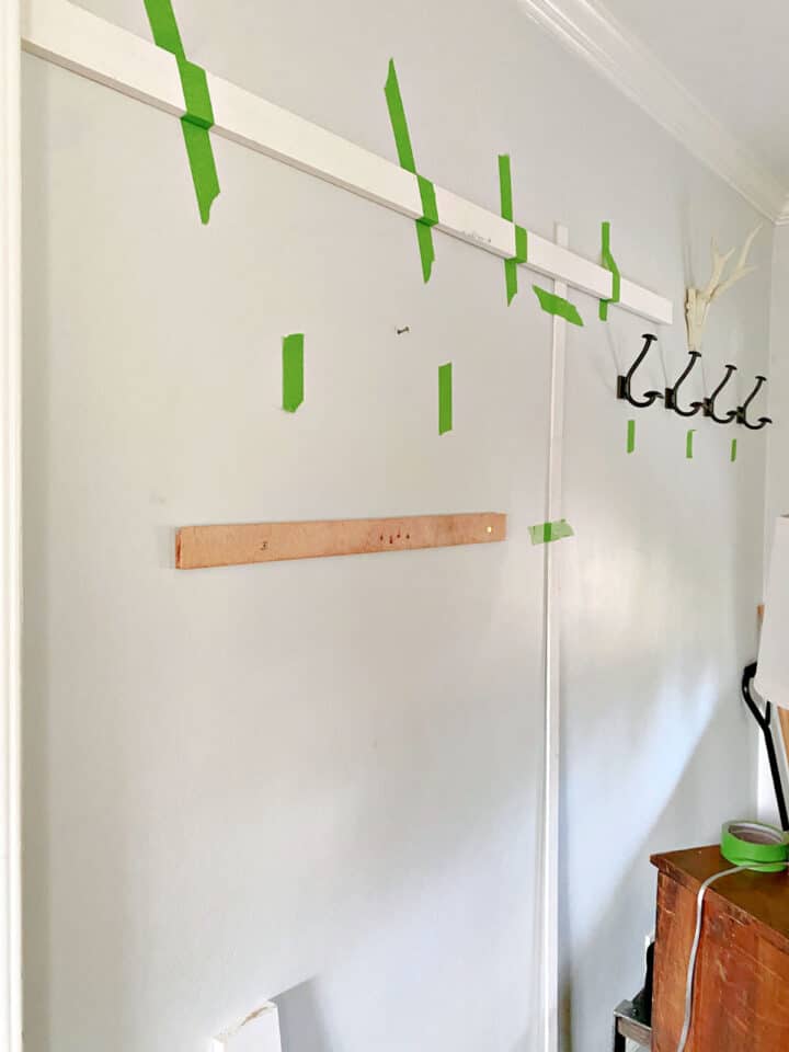 Easy Board and Batten Accent Wall pic boards and painter's tape on gray wall