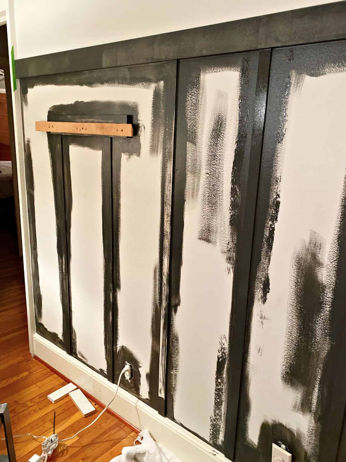 black paint on a board and batten wall