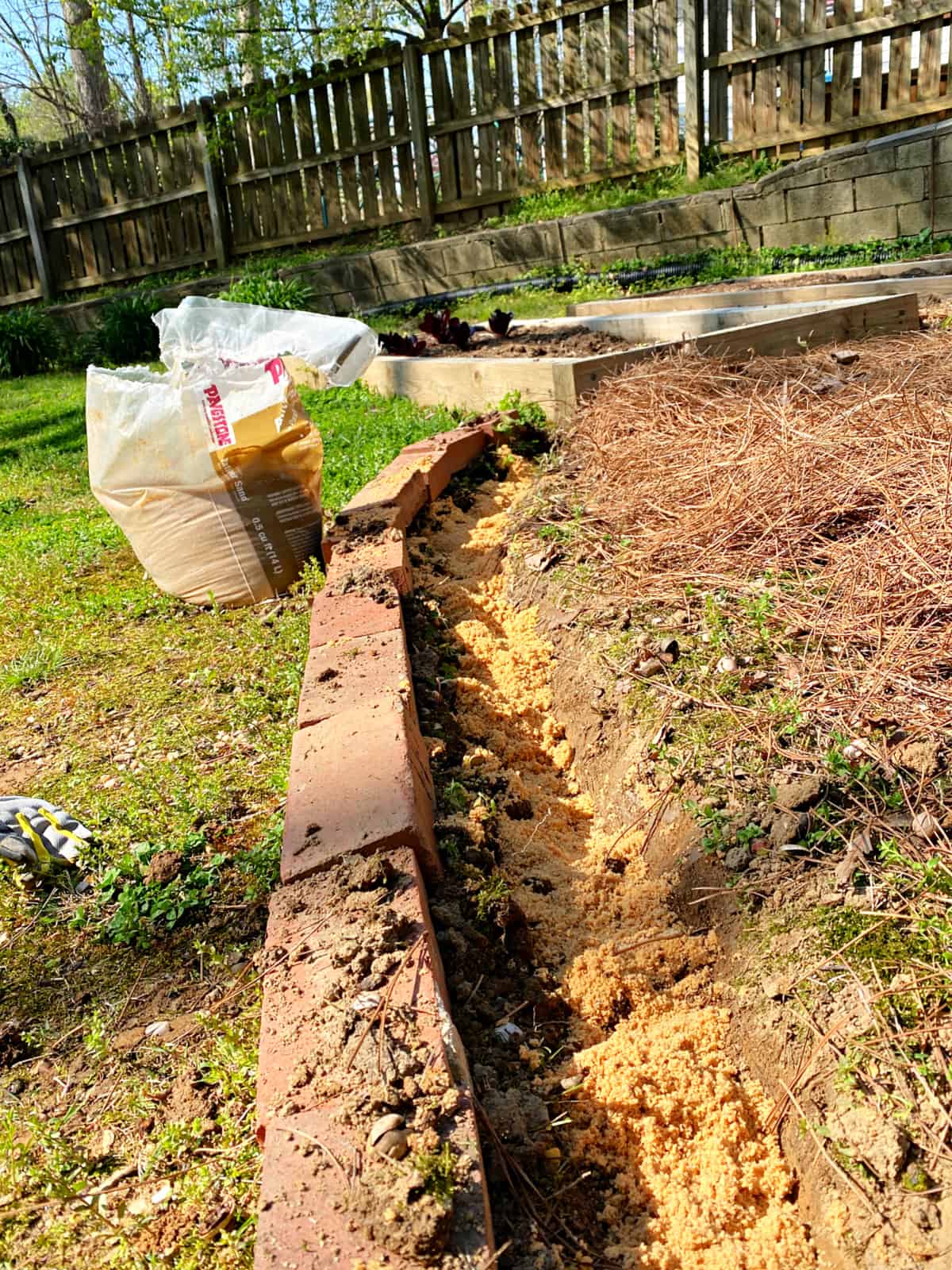 How to Lay Brick Edging In Your Garden photo paver sand in trench for brick border
