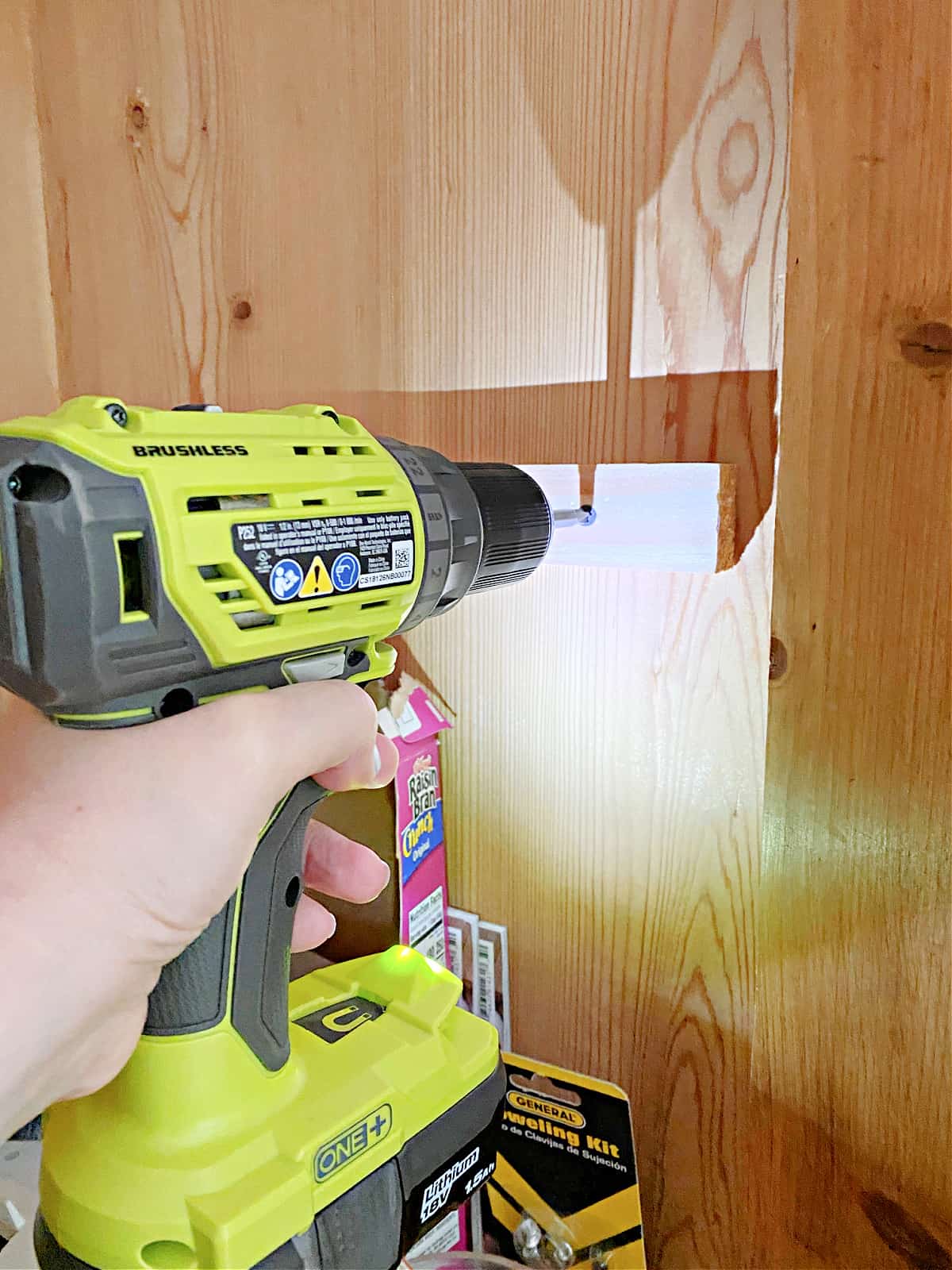 using drill to attach shelf support