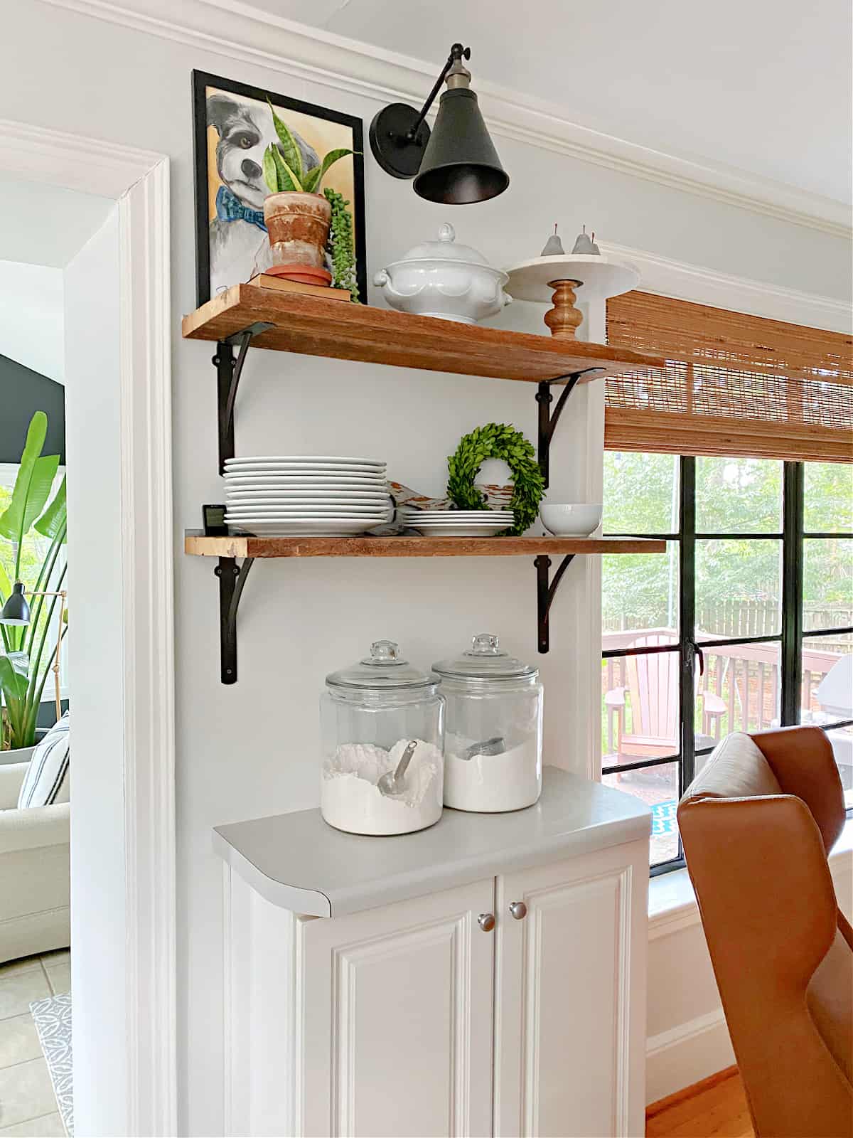 kitchen shelving and wall sconce