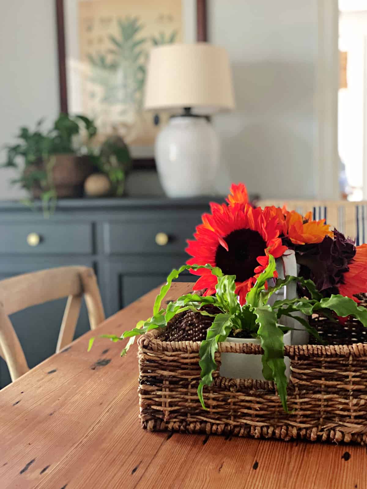 vase of sunflowers on dining room table