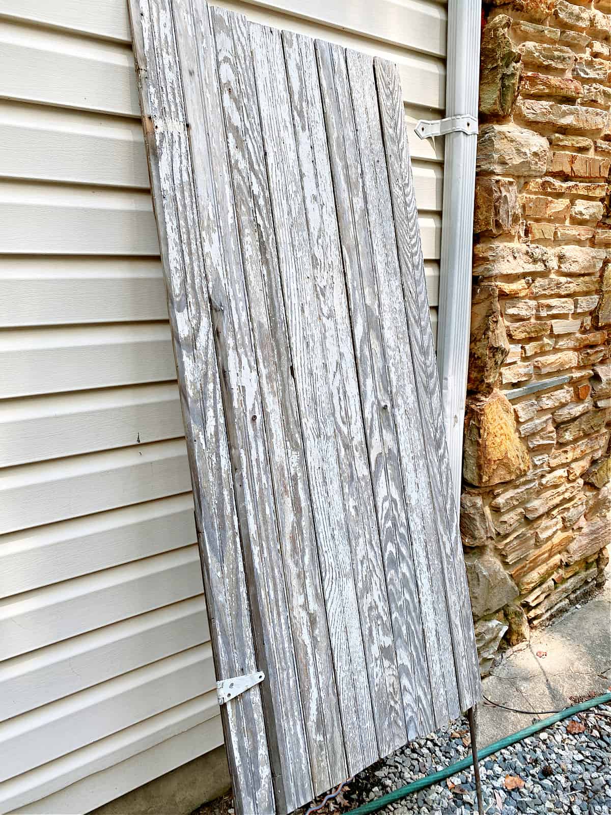 wood panel leaning on house