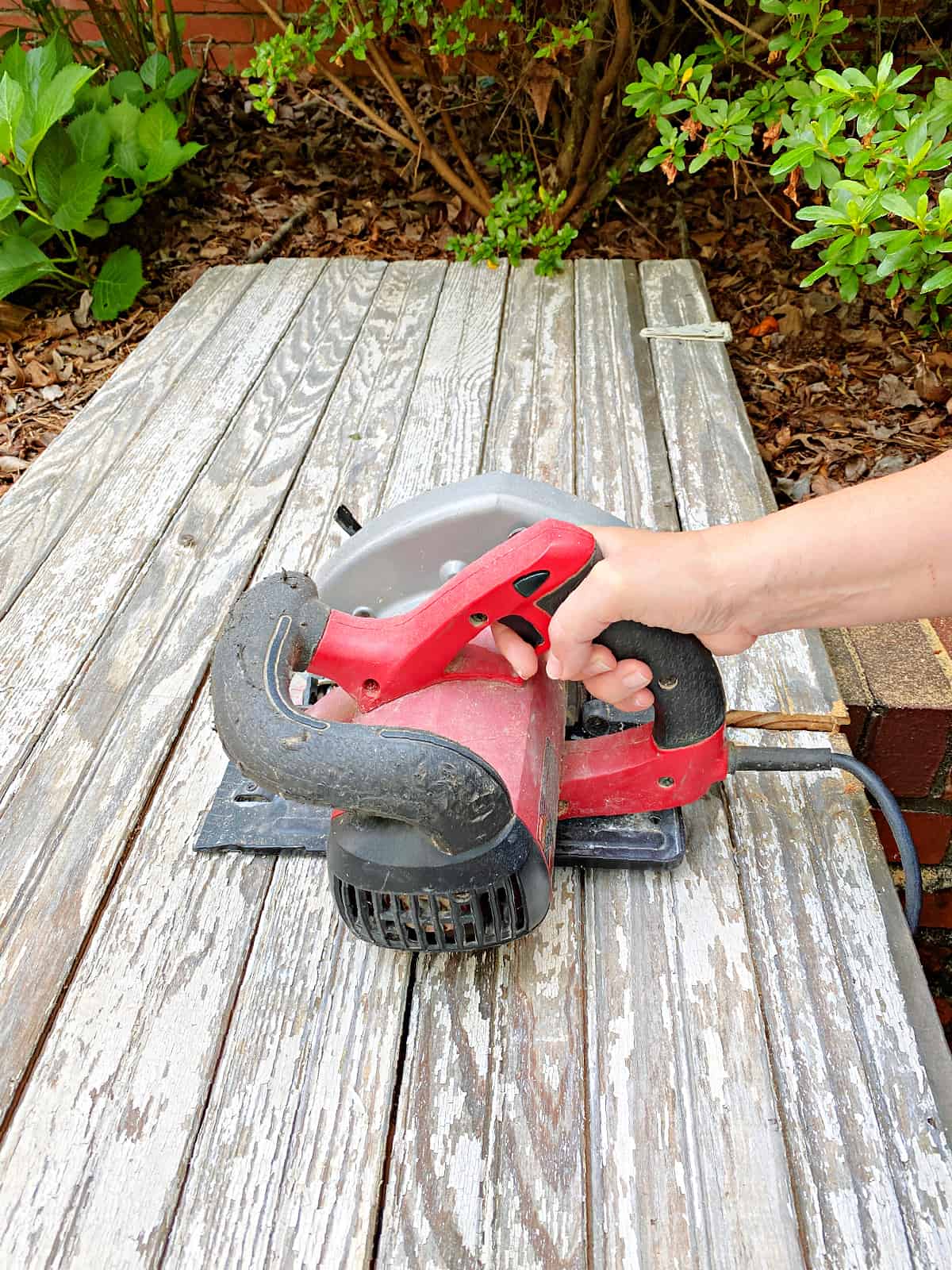 cutting wood panel with saw