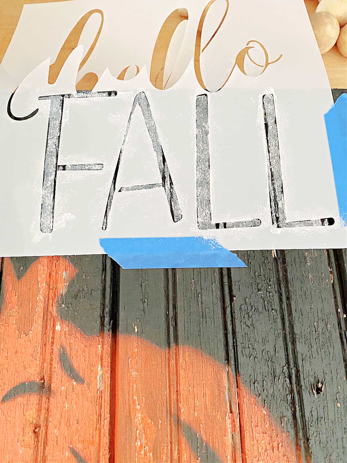 stencil on wood pumpkin sign