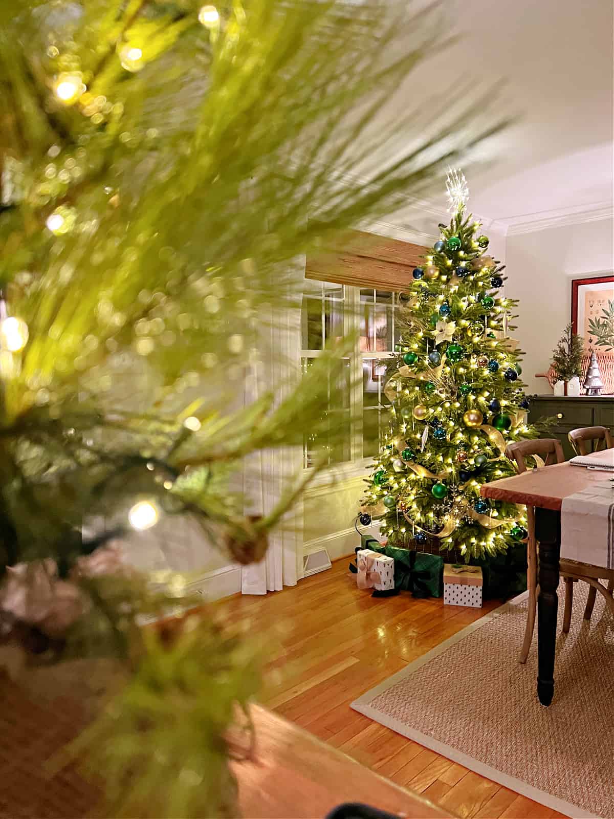 view of Christmas tree through greenery