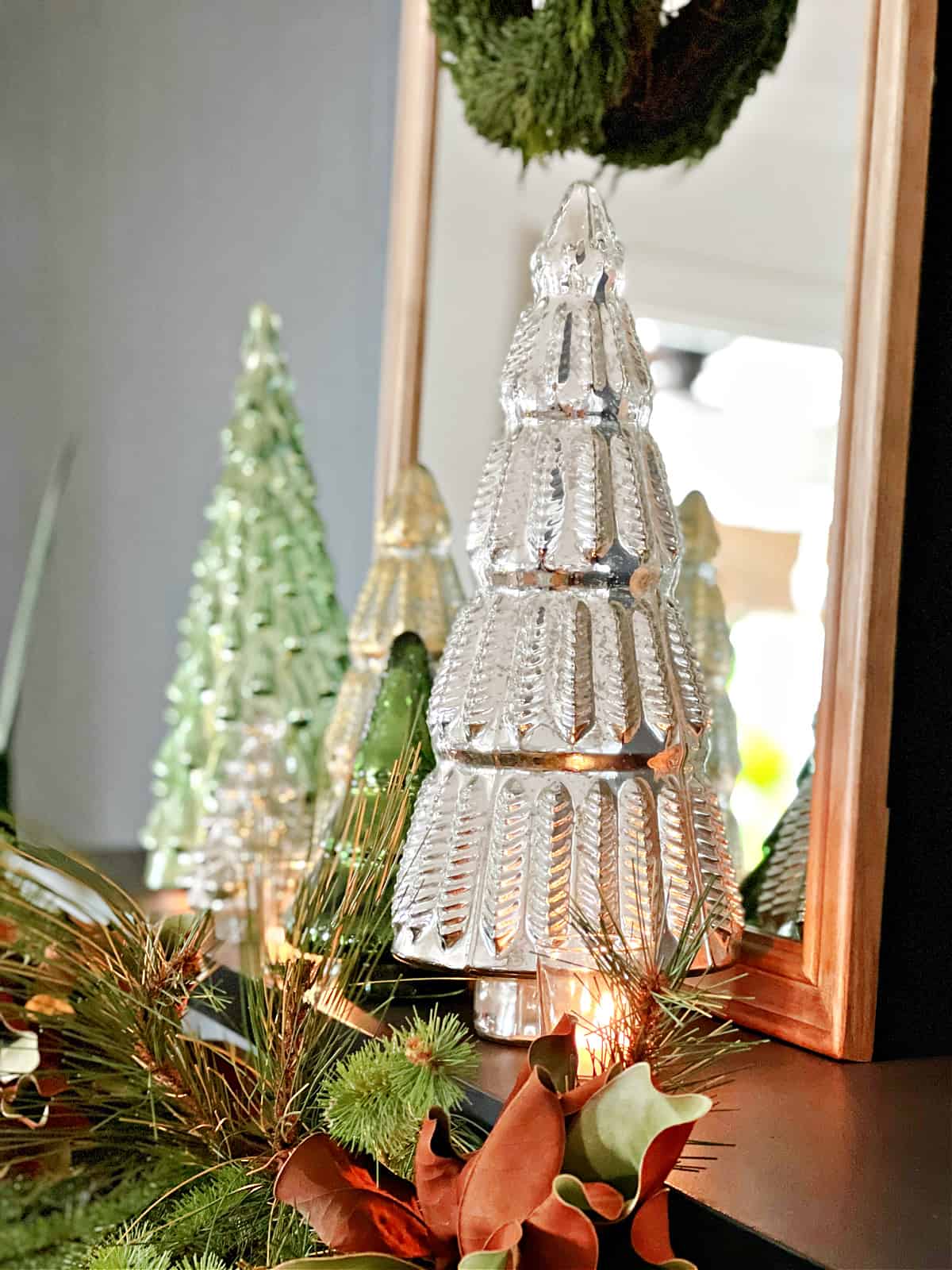 mercury glass Christmas tree on fireplace mantle