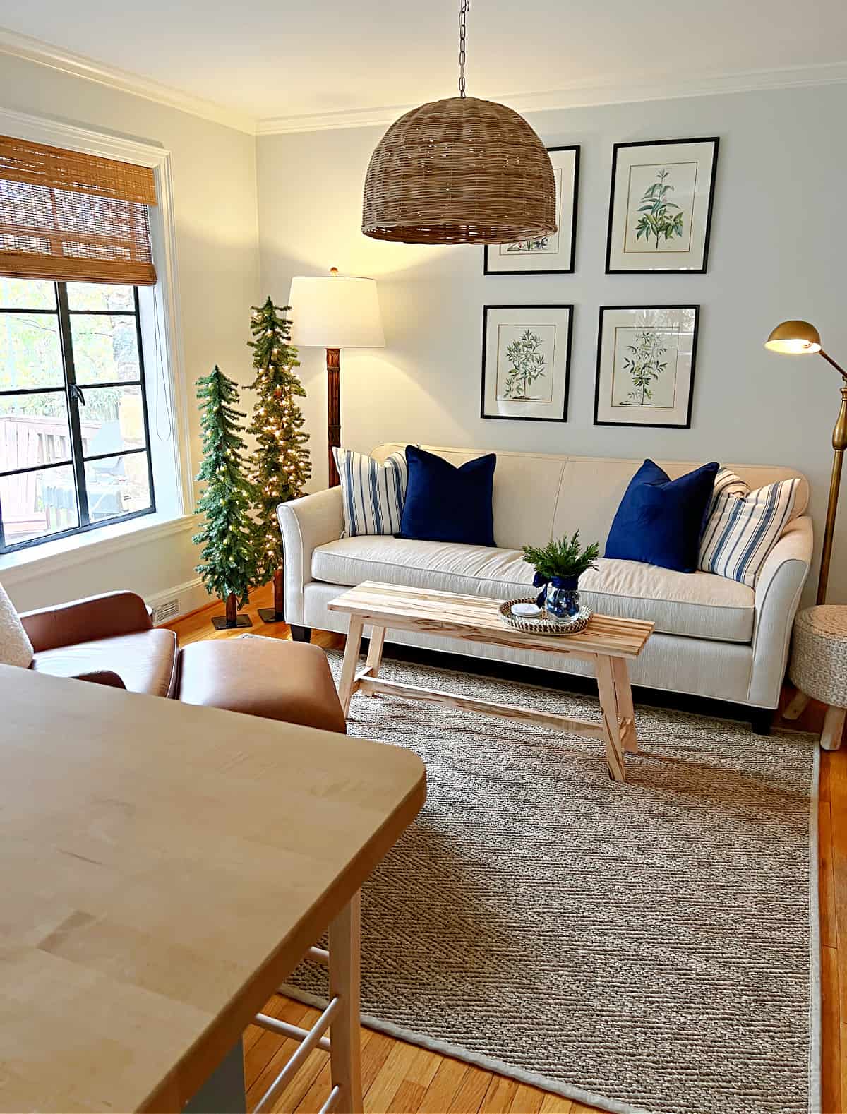small living room with cream sofa and navy pillows