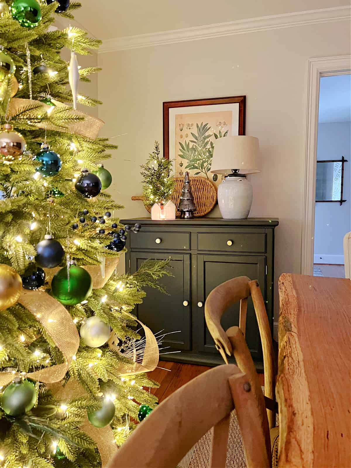 dining room console with mini lighted Christmas tree and lamp