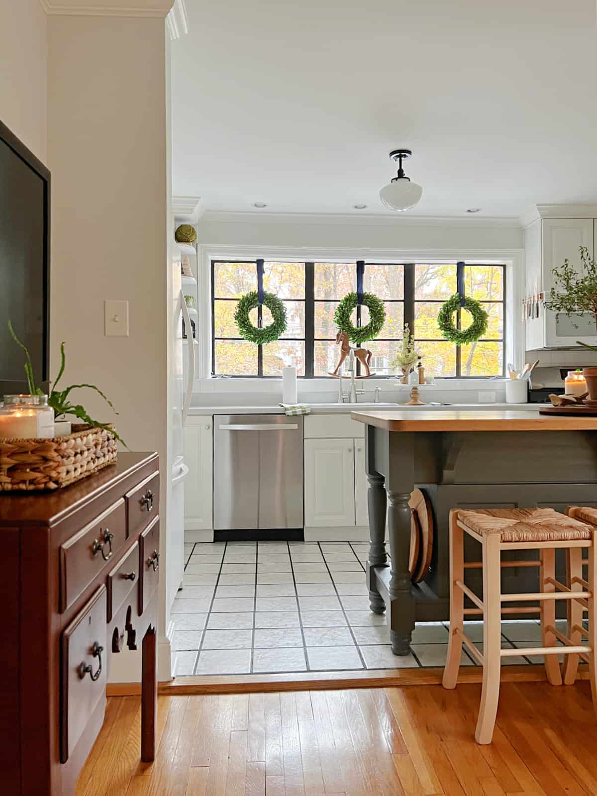 view of kitchen window with wreaths hung on it