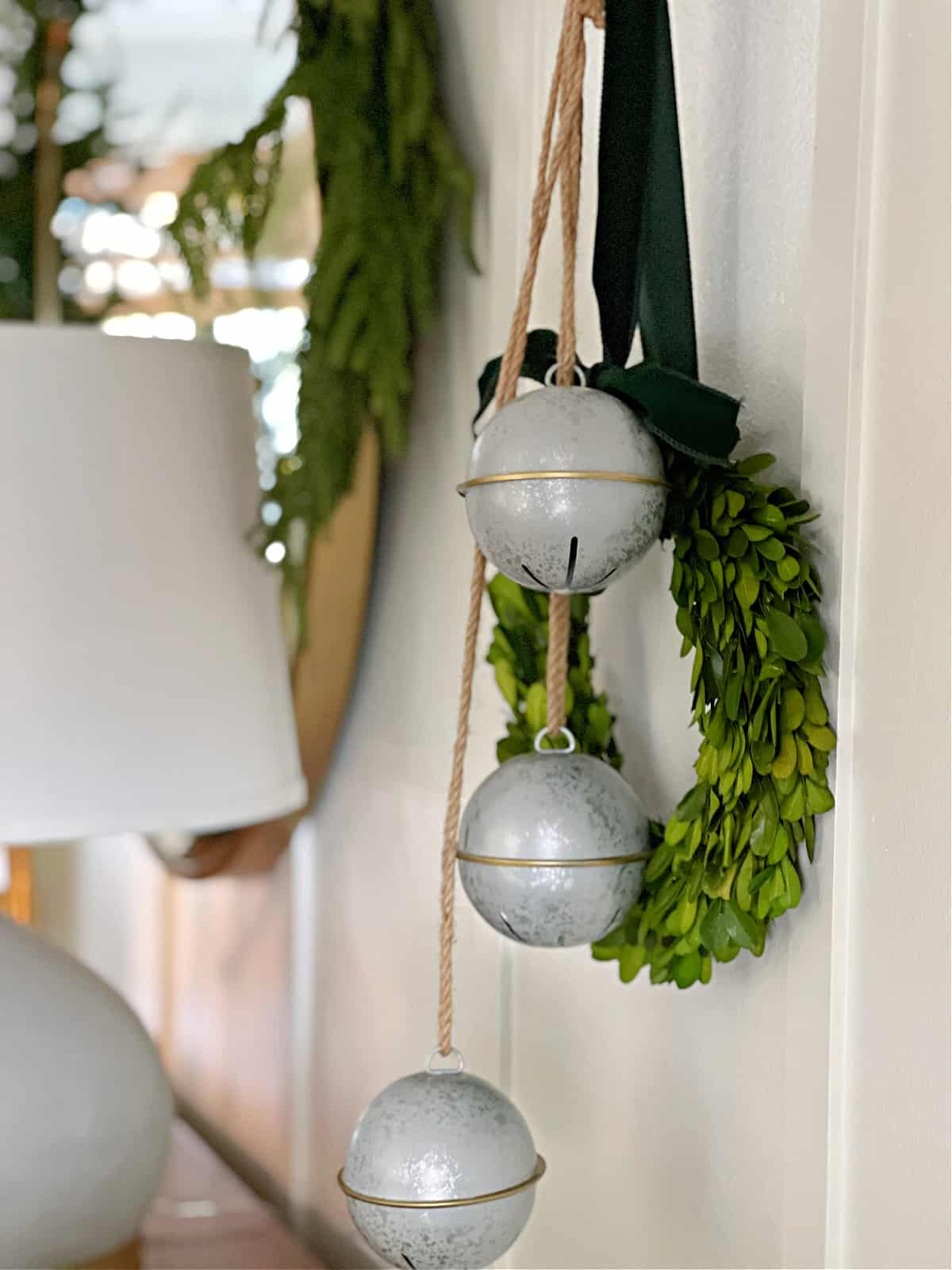 bells and wreath hanging on coat hook