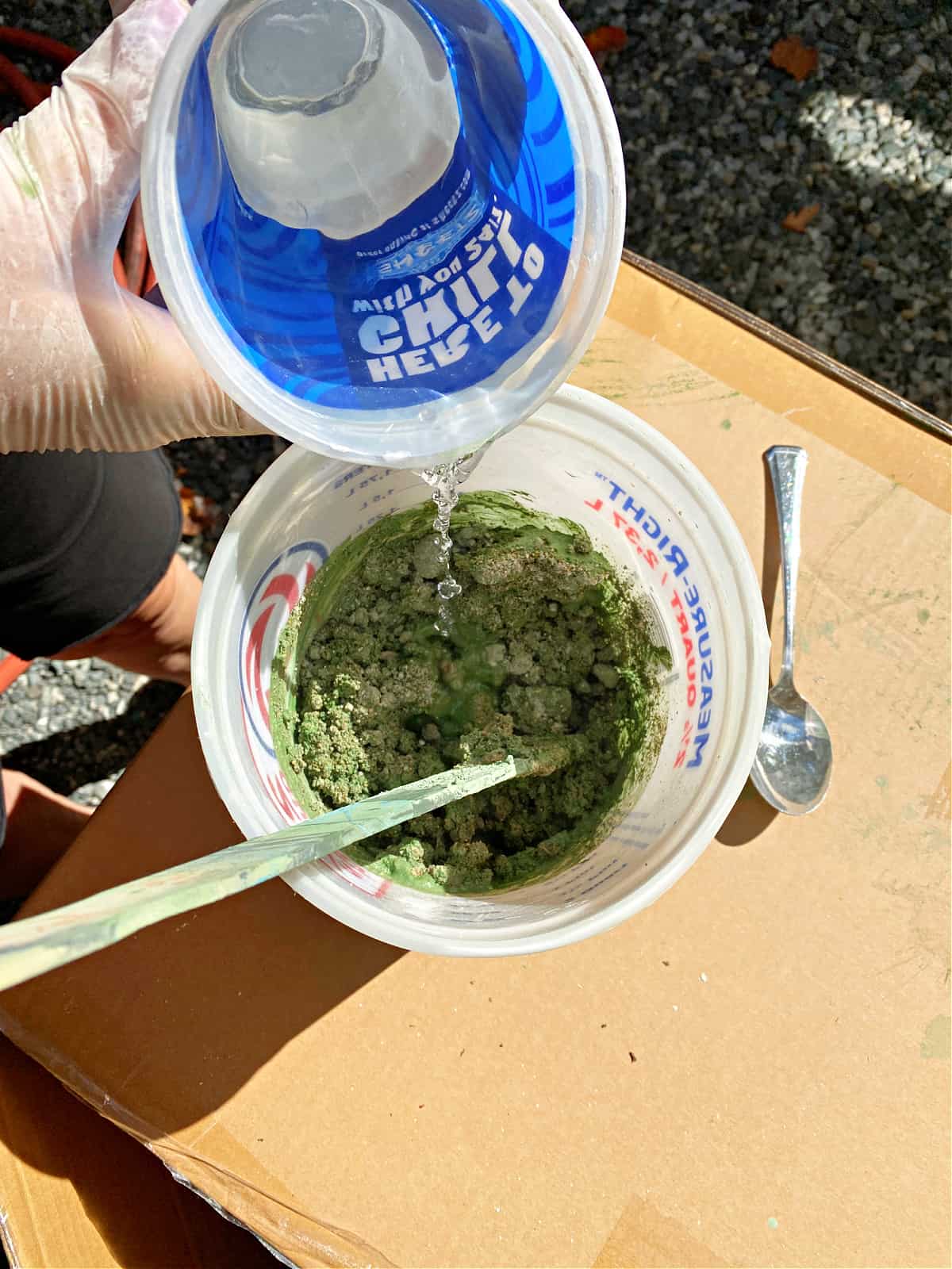 How to Make a Concrete Christmas Tree photograph adding water to green tinted concrete mixture