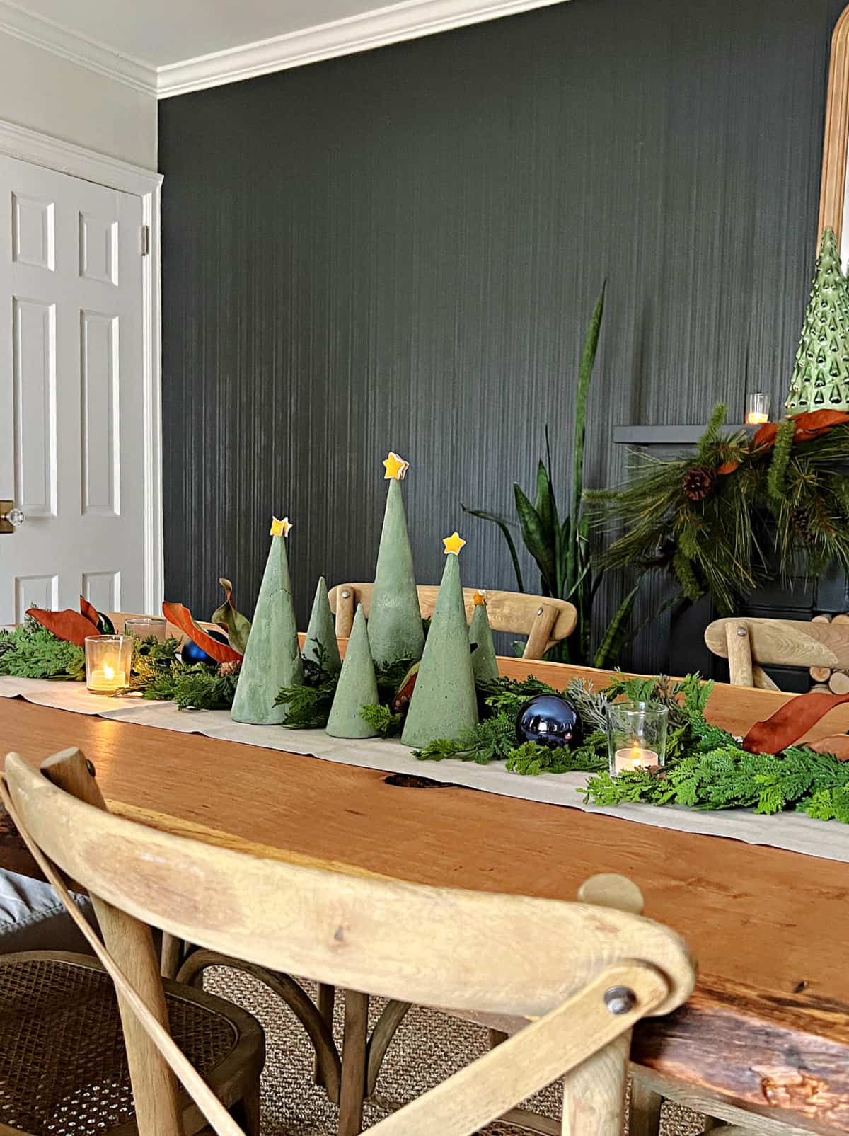 group of green dyed concrete trees on dining room table.