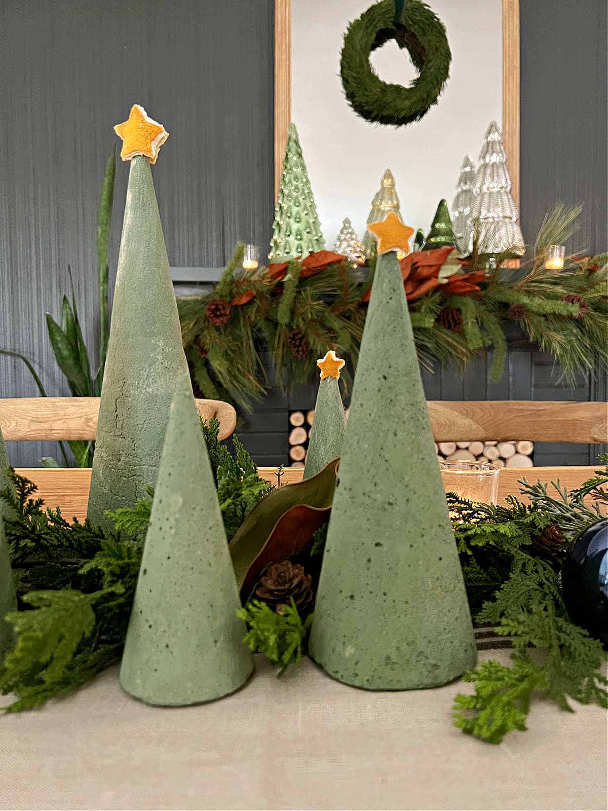 How to Make a Concrete Christmas Tree centerpiece image green dyed concrete Christmas trees on table