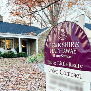 Under contract sign in front of stone house