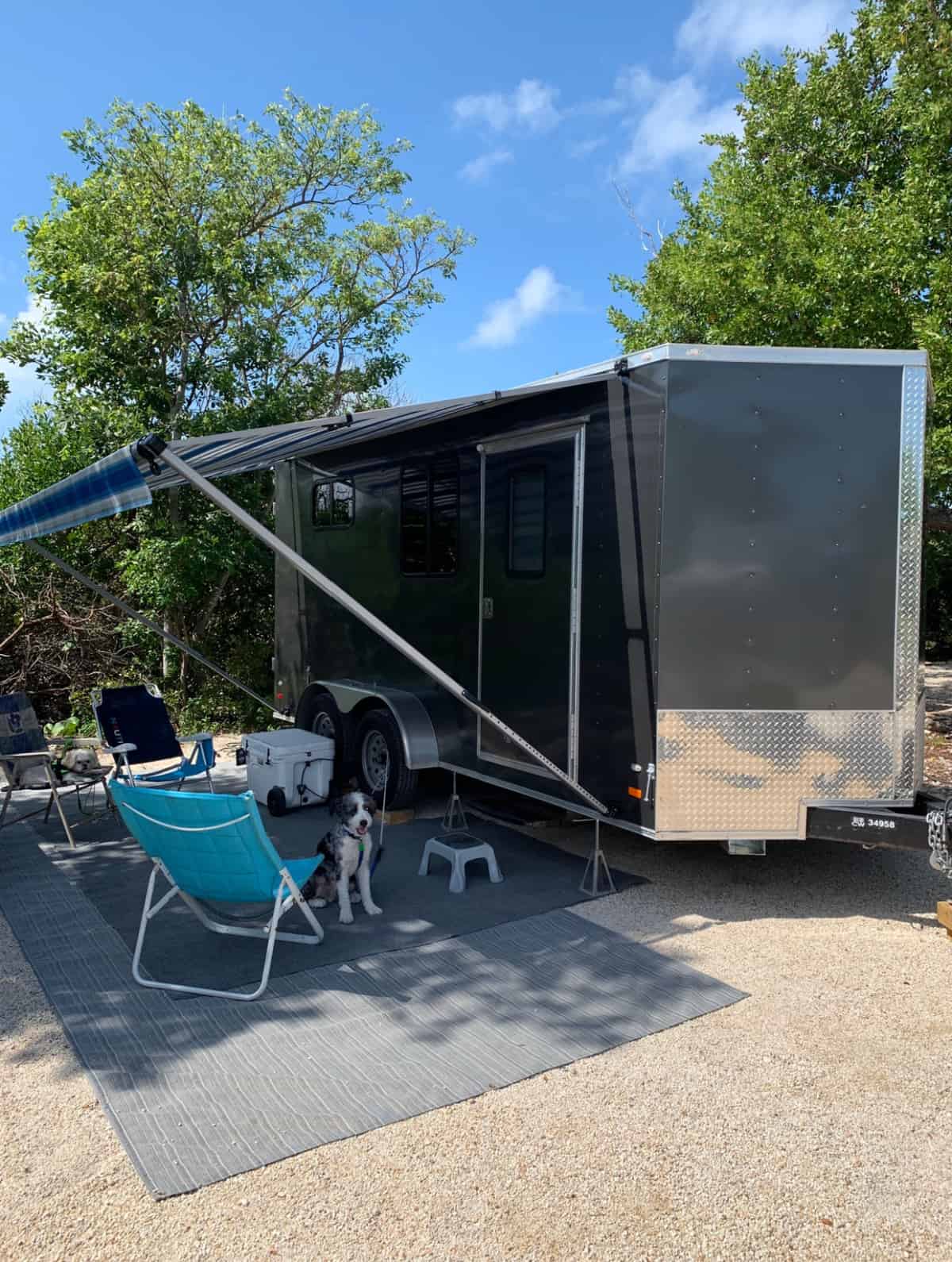 Selling The Cottage and Our Next Chapter pic cargo trailer set up in campsite