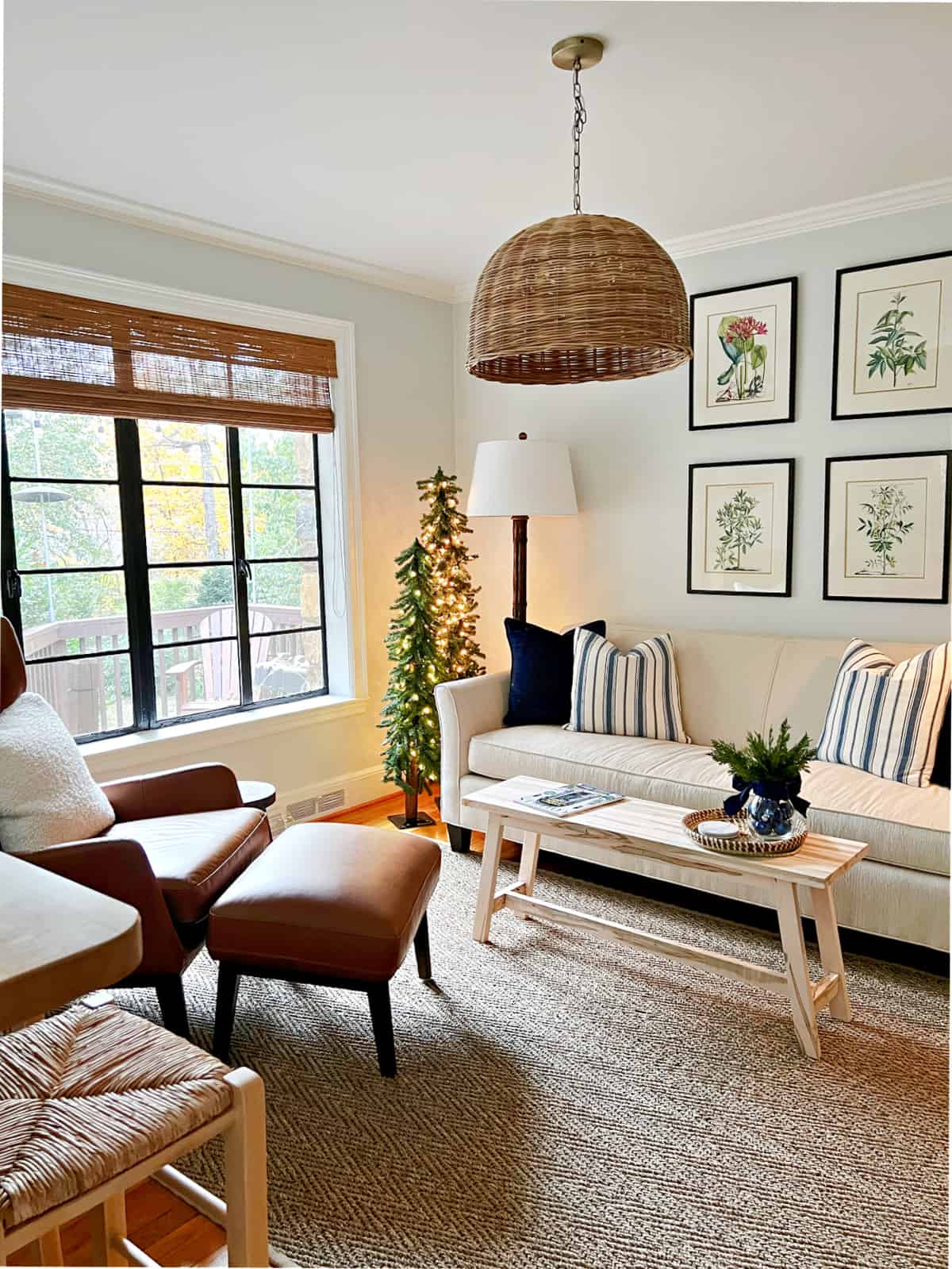 small living room decorated with Christmas trees