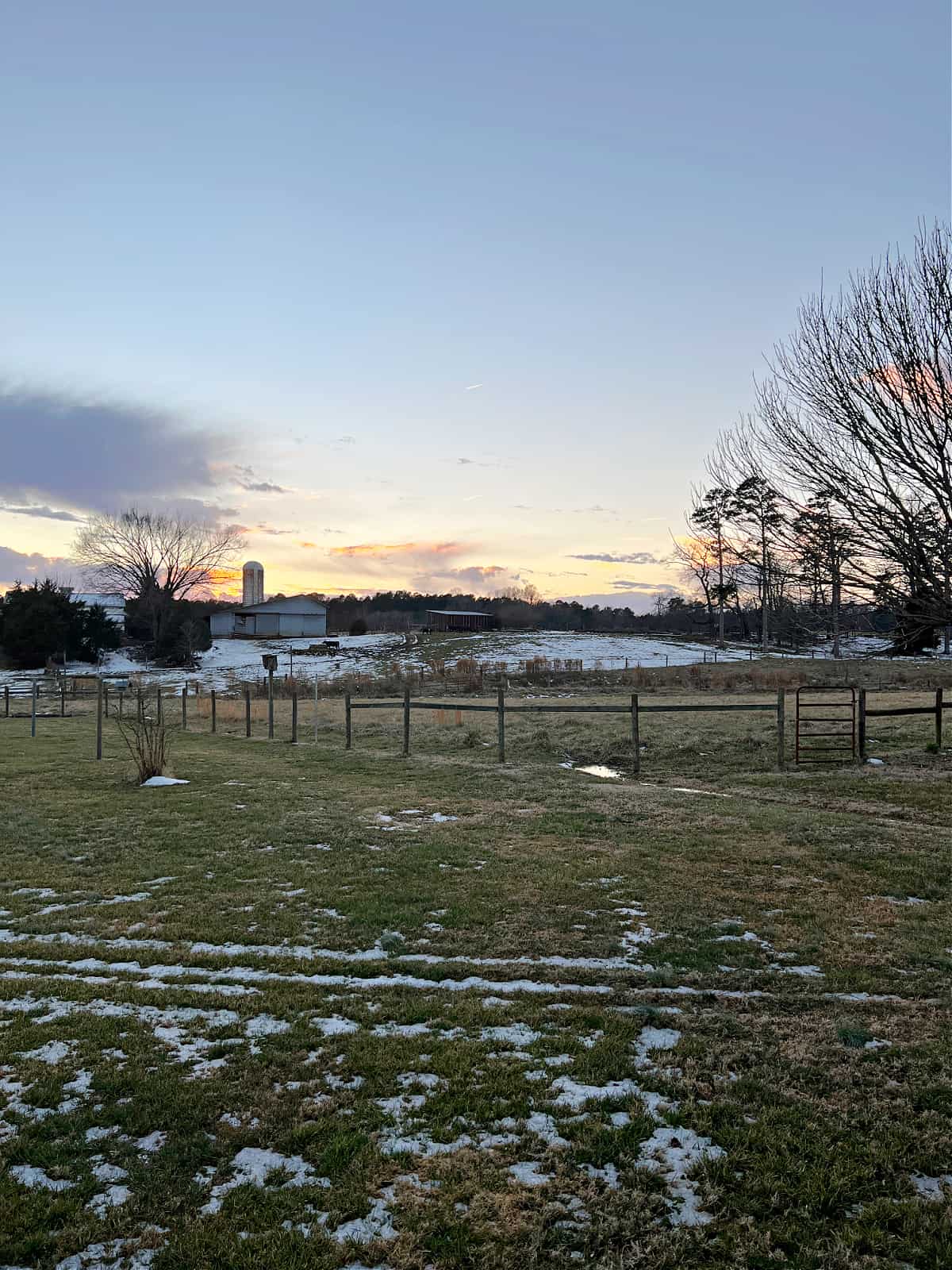 backyard view of fields at sunset 