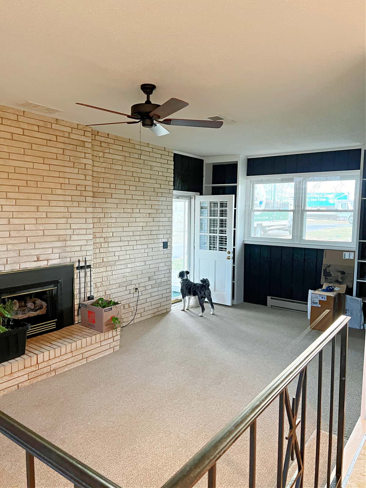 family room view of fireplace wall