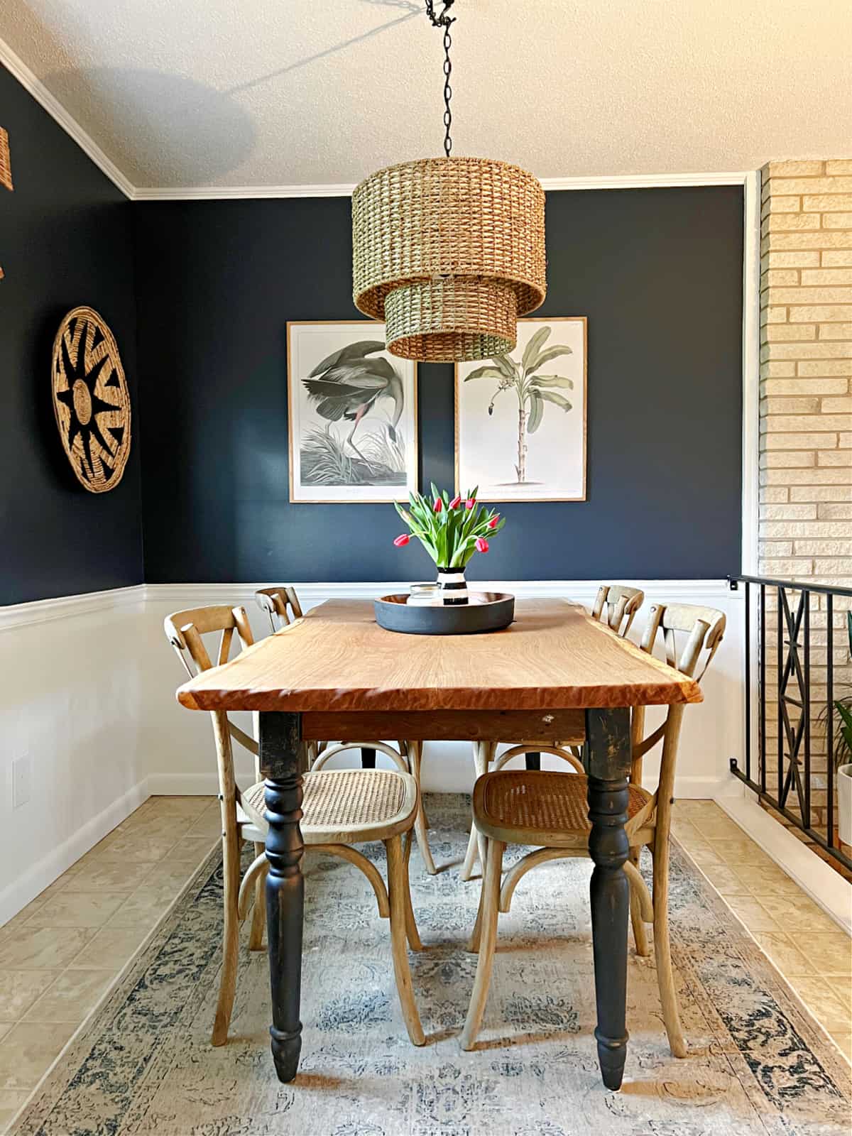 small dining room with navy walls and table and chairs