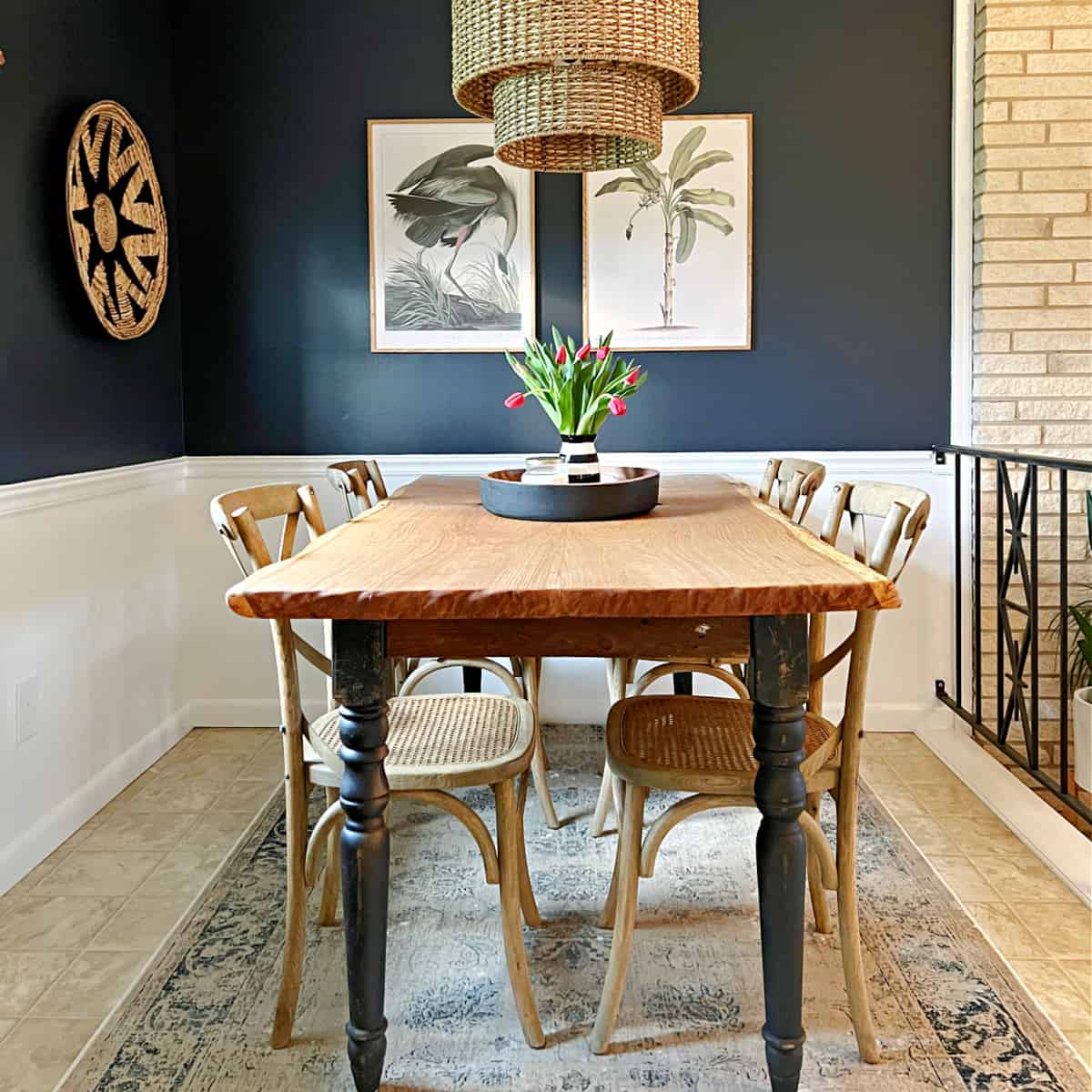 small dining room with navy walls and table and chairs