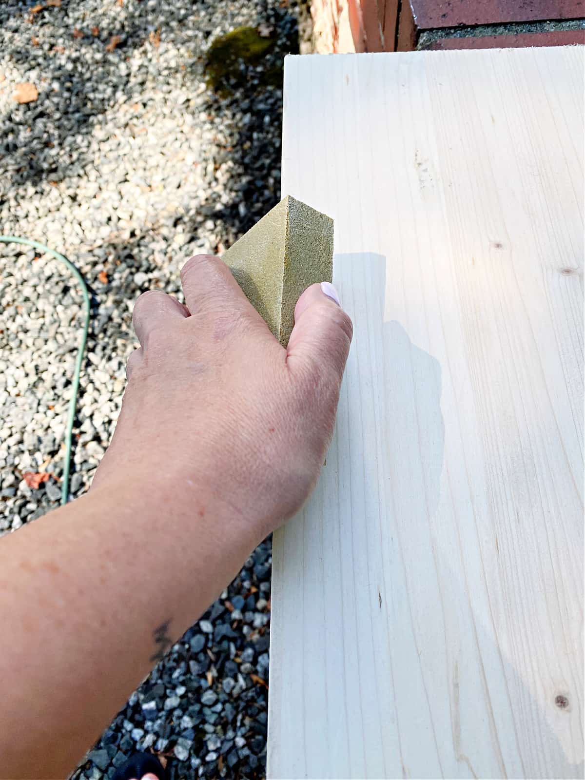 sanding a piece of wood