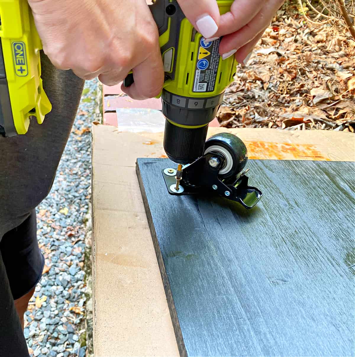 attaching screws to casters with a drill
