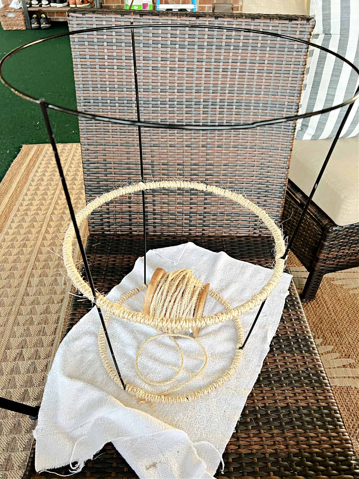 Easy DIY Plant Stand shot process of wrapping twine around rings on tomato cage