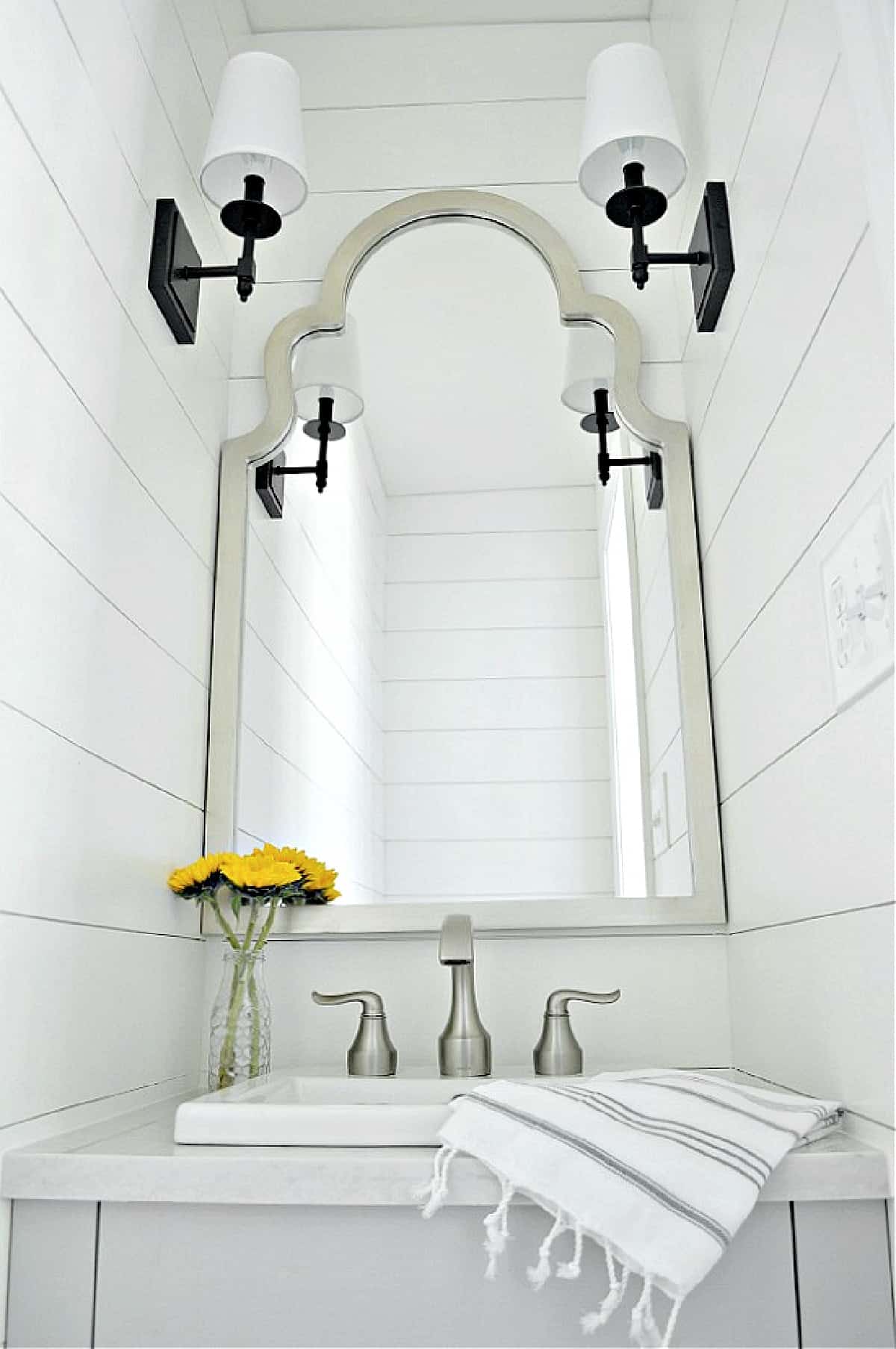 powder room vanity area with mirror