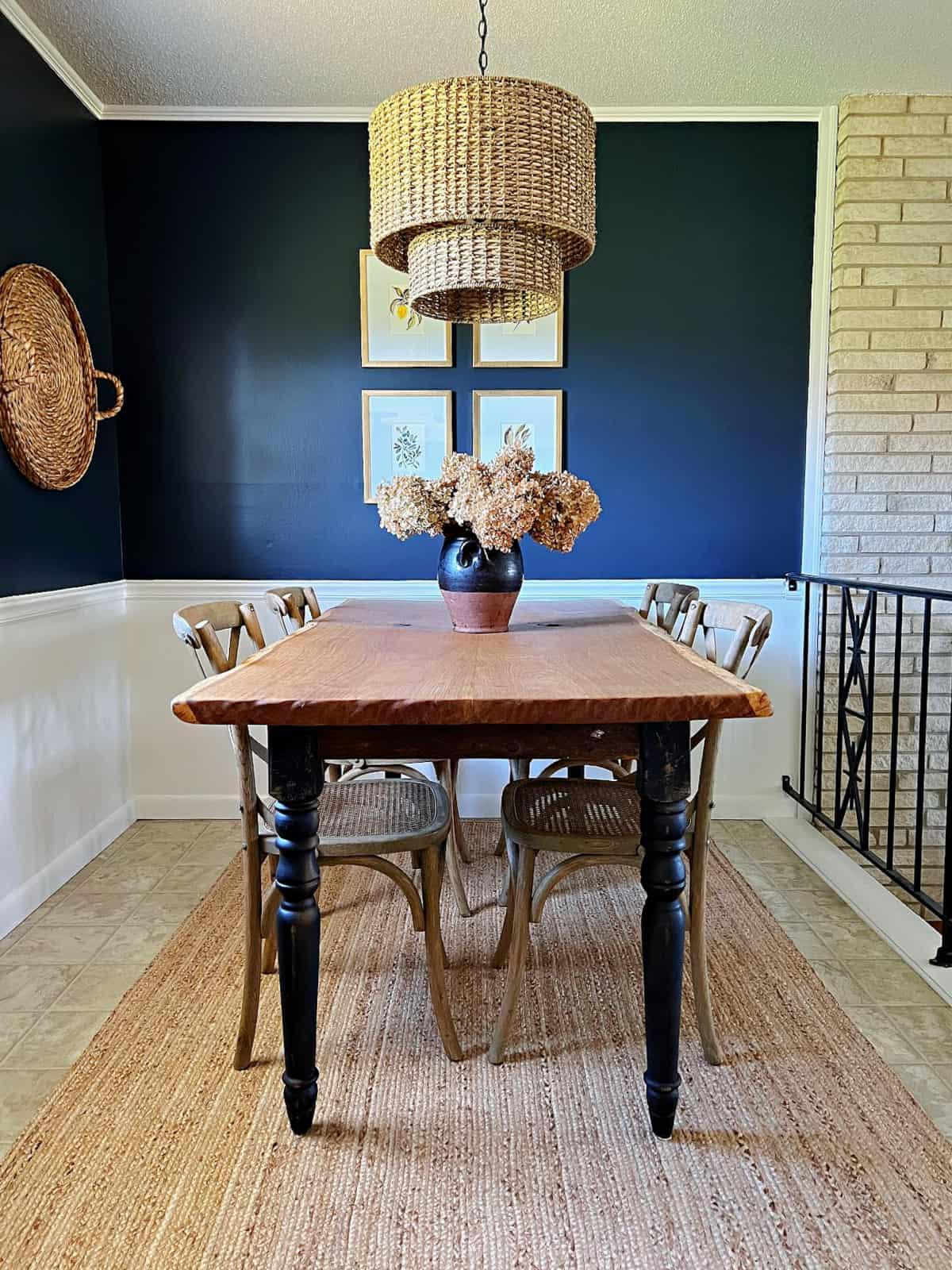 small dining nook with navy painted walls and table and chairs